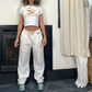 Vintage 00s Reebok white and creamy baggy nylon sweatpants (S-M) blokette